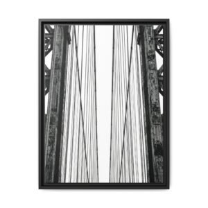 Civil Engineering Bridge Art Vertical black and white photography of suspension bridge cables and steel towers with a minimalist sky background.